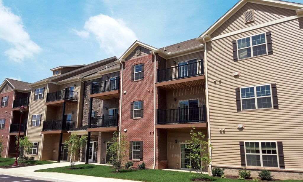 A group of apartment buildings with balconies and windows.