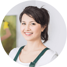 A woman with dark hair wearing an apron.